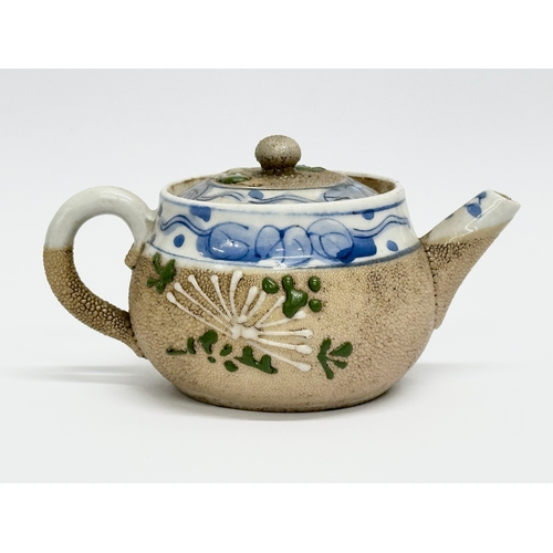 95 - Banko Ware. A small Japanese salt glazed teapot. Late Meiji Period (1868-1912) 12x8x7cm