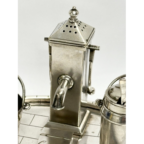 68 - A 19th Century silver plated novelty condiment set/cruet set, in the form of a water pump, milk chur... 