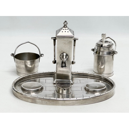 68 - A 19th Century silver plated novelty condiment set/cruet set, in the form of a water pump, milk chur... 