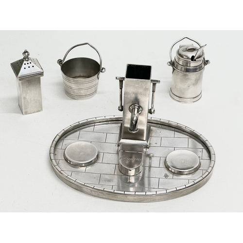 68 - A 19th Century silver plated novelty condiment set/cruet set, in the form of a water pump, milk chur... 