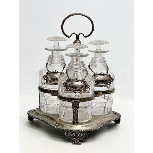 77 - A 19th Century Victorian 3 glass decanter set on stand. With 3 rings and silver plated labels. Whisk... 