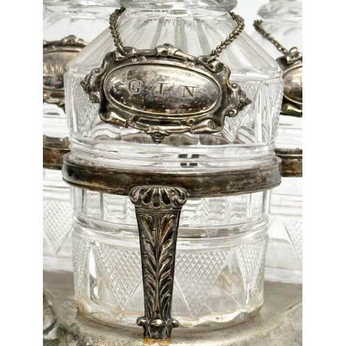 77 - A 19th Century Victorian 3 glass decanter set on stand. With 3 rings and silver plated labels. Whisk... 