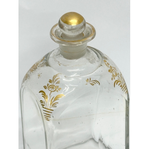 75 - An Early 19th Century French gilded glass decanter bottle. 8x6x16cm.