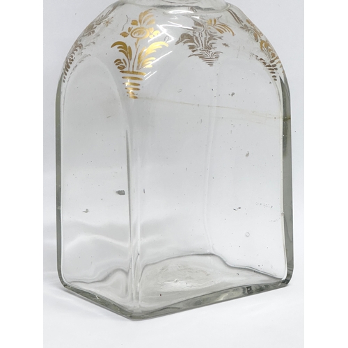 75 - An Early 19th Century French gilded glass decanter bottle. 8x6x16cm.