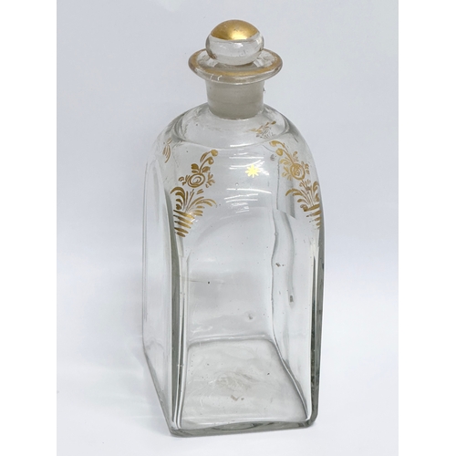 75 - An Early 19th Century French gilded glass decanter bottle. 8x6x16cm.