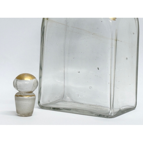 75 - An Early 19th Century French gilded glass decanter bottle. 8x6x16cm.