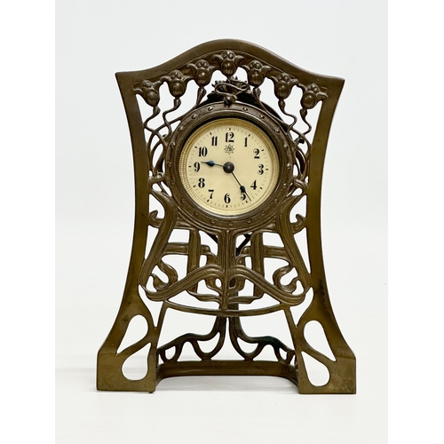 518 - An Early 20th Century Art Nouveau brass framed mantle clock. Junghans. 14x4x19cm