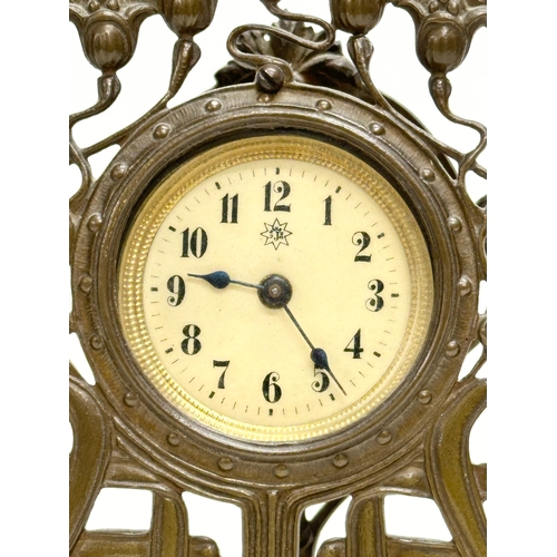 518 - An Early 20th Century Art Nouveau brass framed mantle clock. Junghans. 14x4x19cm