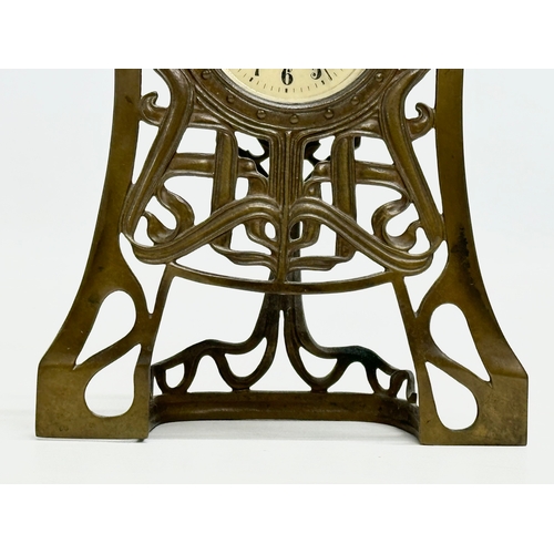 518 - An Early 20th Century Art Nouveau brass framed mantle clock. Junghans. 14x4x19cm