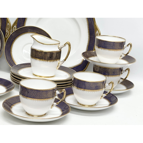 240 - Royal Albert. A 1920’s 36 piece Royal Albert gilt and cobalt blue crown china tea service.