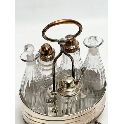 147 - A large Late 19th Century Victorian cruet set. Silver plate on copper. Vinegar bottles, salt and pep... 