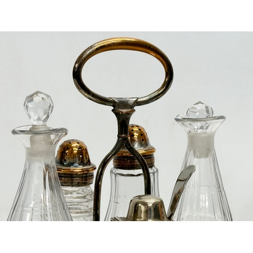 147 - A large Late 19th Century Victorian cruet set. Silver plate on copper. Vinegar bottles, salt and pep... 