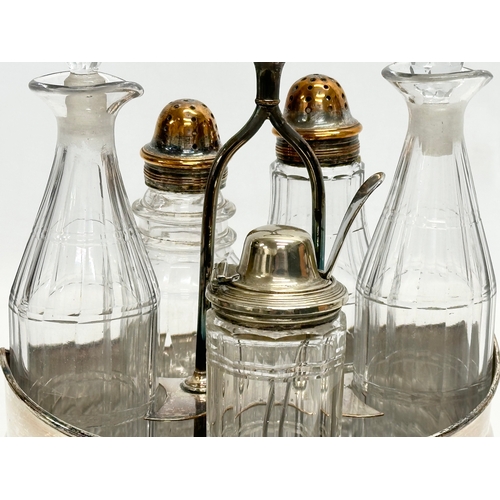 147 - A large Late 19th Century Victorian cruet set. Silver plate on copper. Vinegar bottles, salt and pep... 