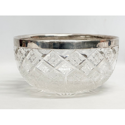 149 - Elkington & Co. A 19th Century serving bowl with matching utensils. Plated rim on a glass star cut b... 