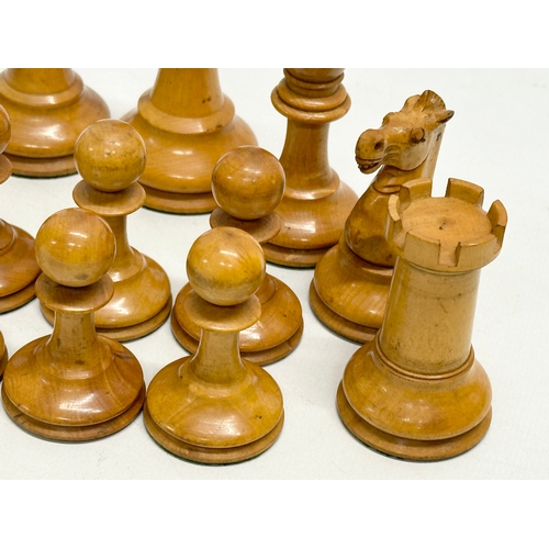 82 - A complete “Staunton” chess set. With red crown mark. Late 19th/Early 20th Century. Hand turned and ... 