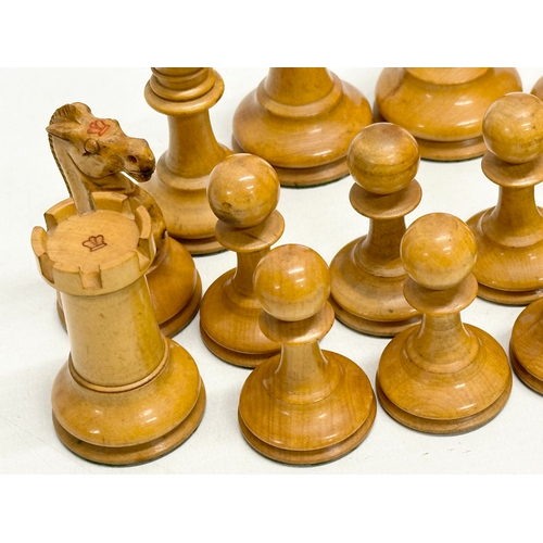 82 - A complete “Staunton” chess set. With red crown mark. Late 19th/Early 20th Century. Hand turned and ... 