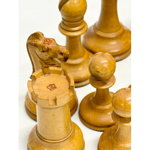 82 - A complete “Staunton” chess set. With red crown mark. Late 19th/Early 20th Century. Hand turned and ... 