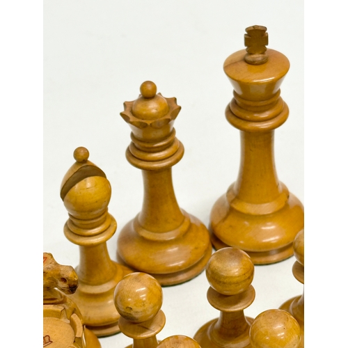 82 - A complete “Staunton” chess set. With red crown mark. Late 19th/Early 20th Century. Hand turned and ... 