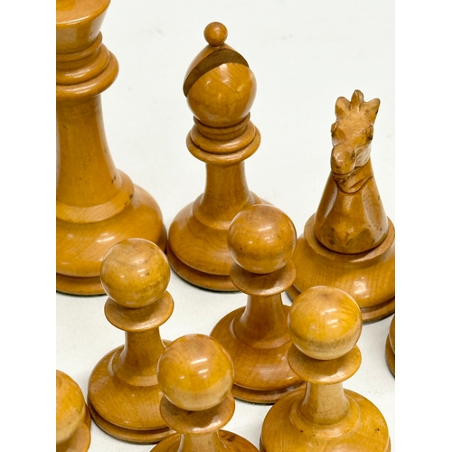 82 - A complete “Staunton” chess set. With red crown mark. Late 19th/Early 20th Century. Hand turned and ... 