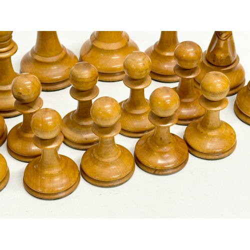 82 - A complete “Staunton” chess set. With red crown mark. Late 19th/Early 20th Century. Hand turned and ... 