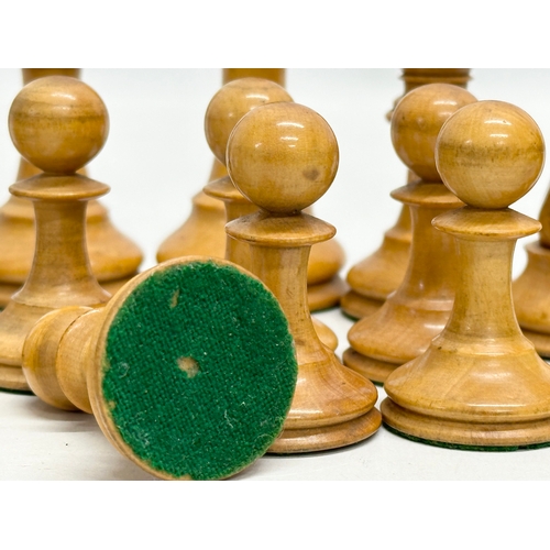 82 - A complete “Staunton” chess set. With red crown mark. Late 19th/Early 20th Century. Hand turned and ... 