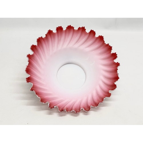 108 - A large Late 19th/Early 20th Century cranberry and milk glass centrepiece bowl, with ruffled rim. Ci... 