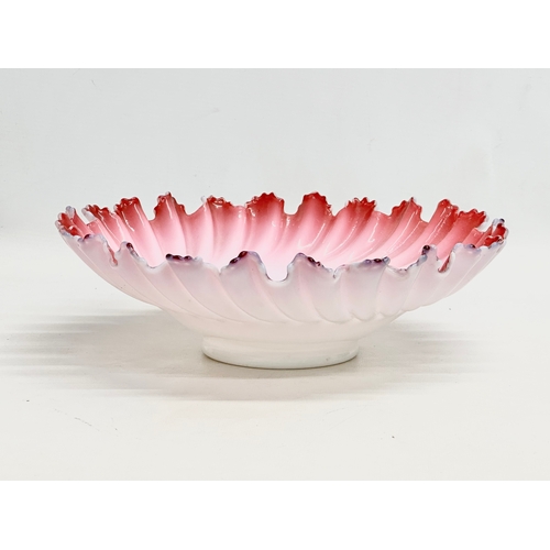 108 - A large Late 19th/Early 20th Century cranberry and milk glass centrepiece bowl, with ruffled rim. Ci... 