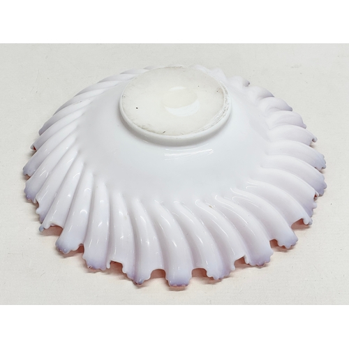 108 - A large Late 19th/Early 20th Century cranberry and milk glass centrepiece bowl, with ruffled rim. Ci... 