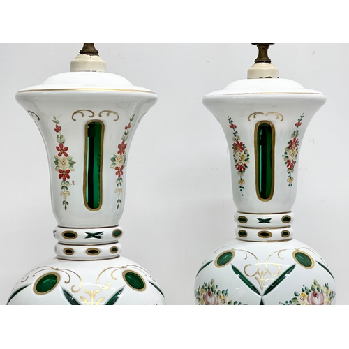 6 - A pair of large Early 20th Century Bohemian enamelled glass table lamps, on gilt brass bases. 23x59c... 