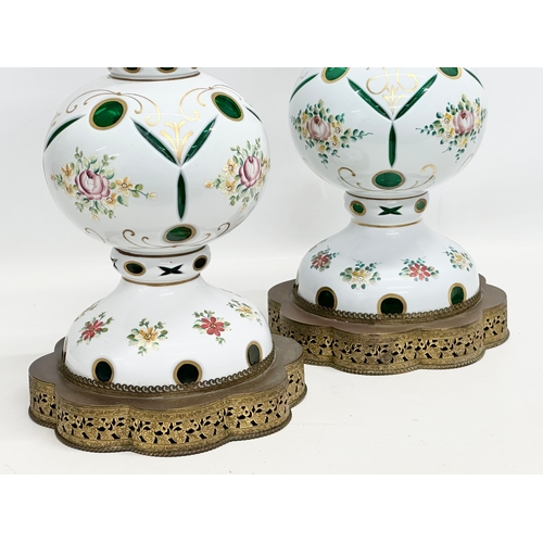 6 - A pair of large Early 20th Century Bohemian enamelled glass table lamps, on gilt brass bases. 23x59c... 