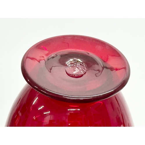 152 - A ruby glass jug. 11x9x20.5cm.