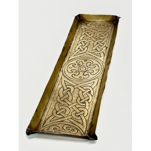 46 - A pair of Early 20th Century Art Nouveau brass trays. In the manner of Alexander Richie. 28.5x9cm