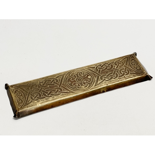 46 - A pair of Early 20th Century Art Nouveau brass trays. In the manner of Alexander Richie. 28.5x9cm