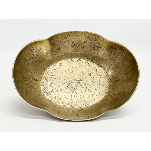 196 - A Late 19th Century Chinese engraved brass bowl. 29x22x8cm.