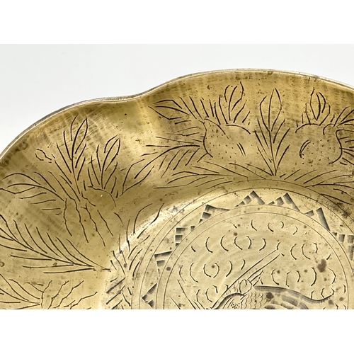 196 - A Late 19th Century Chinese engraved brass bowl. 29x22x8cm.