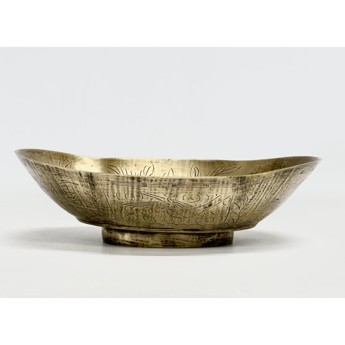 196 - A Late 19th Century Chinese engraved brass bowl. 29x22x8cm.