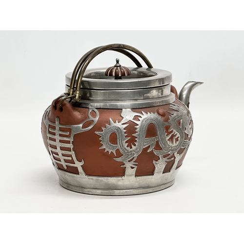 99 - A Late 19th/Early 20th Century Chinese pewter mounted Yixing teapot. Impressed seal mark on bottom. ... 