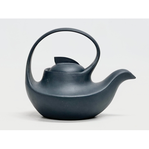 100 - A 20th Century Chinese Yixing teapot. With multiple impressed seal marks. Wang Yinxian/Zhang Shouzhi... 