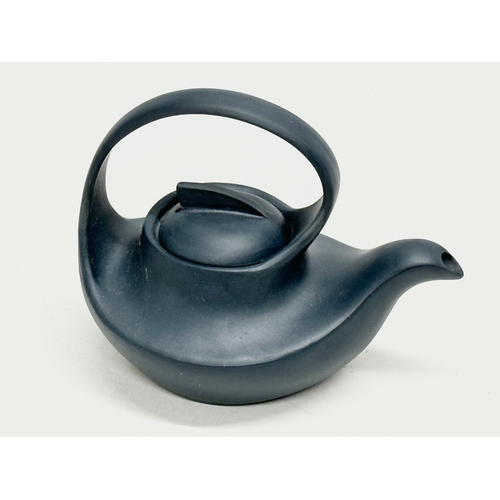 100 - A 20th Century Chinese Yixing teapot. With multiple impressed seal marks. Wang Yinxian/Zhang Shouzhi... 