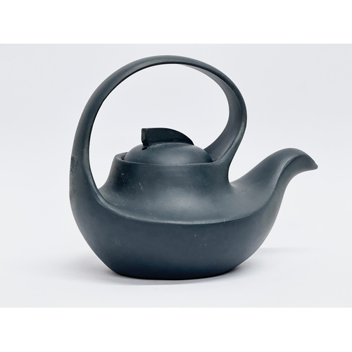 100 - A 20th Century Chinese Yixing teapot. With multiple impressed seal marks. Wang Yinxian/Zhang Shouzhi... 