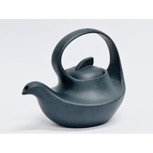 100 - A 20th Century Chinese Yixing teapot. With multiple impressed seal marks. Wang Yinxian/Zhang Shouzhi... 