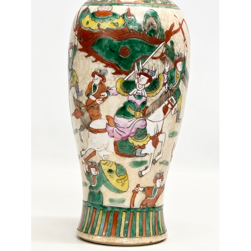 101 - A Late 19th Century Chinese crackled glazed Nanjing vase. Decorated with battle scene warriors. 26cm