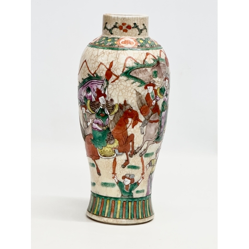 101 - A Late 19th Century Chinese crackled glazed Nanjing vase. Decorated with battle scene warriors. 26cm