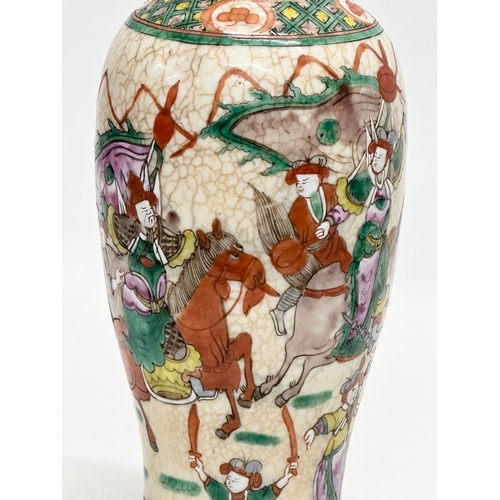 101 - A Late 19th Century Chinese crackled glazed Nanjing vase. Decorated with battle scene warriors. 26cm