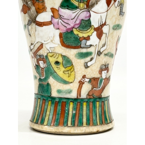 101 - A Late 19th Century Chinese crackled glazed Nanjing vase. Decorated with battle scene warriors. 26cm