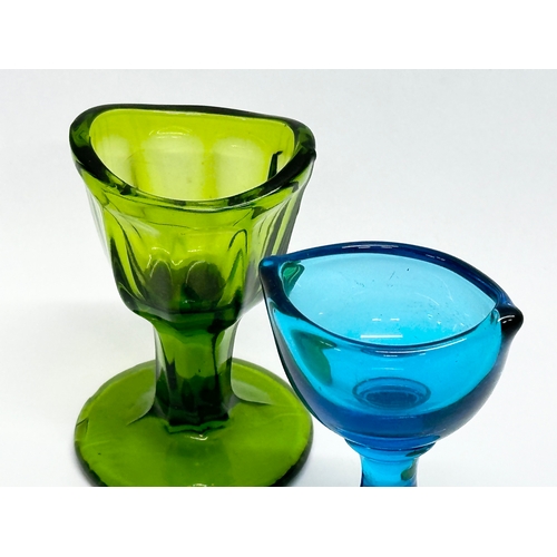 213 - Two Late 19th Century coloured glass eye baths.