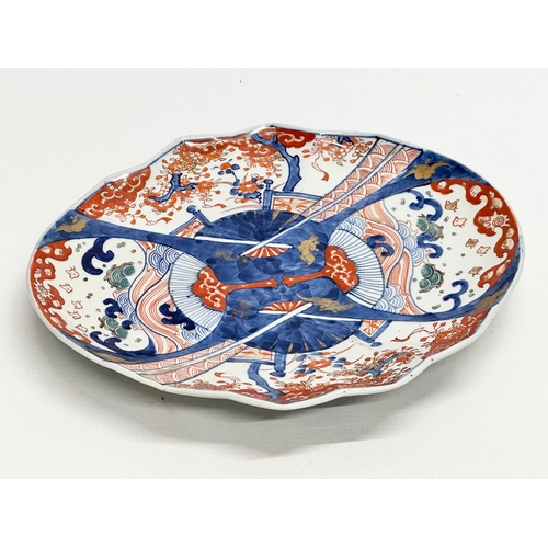 218 - A Japanese Imari pattern fan shaped plate. Meiji Period (1868-1912) Late 19th/Early 20th Century. 31... 