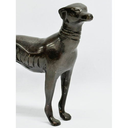 219 - A bronze whippet. 15x13cm.