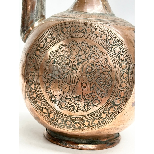 50 - A Late 18th/Early 19th Century Afghan engraved copper ewer. 19x12x35cm