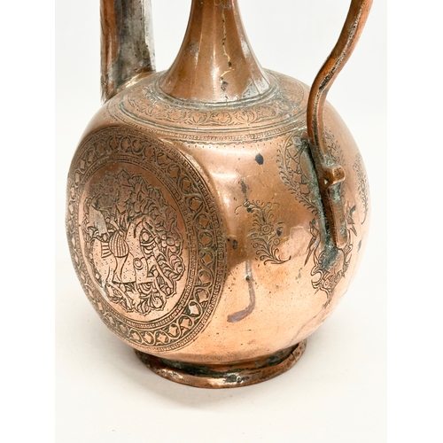 50 - A Late 18th/Early 19th Century Afghan engraved copper ewer. 19x12x35cm